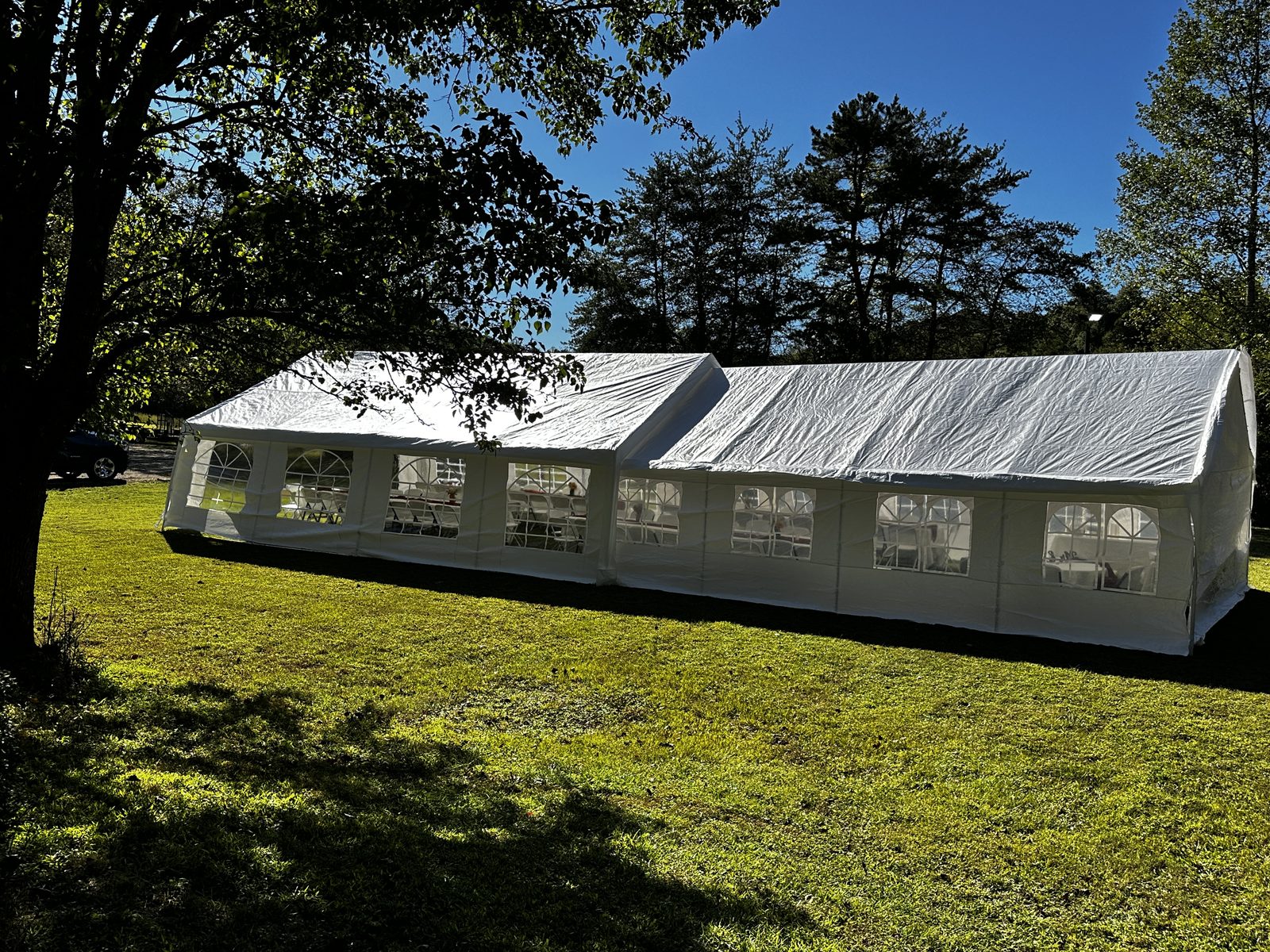 Two joined white tents on the field at Riverside Farm Venue