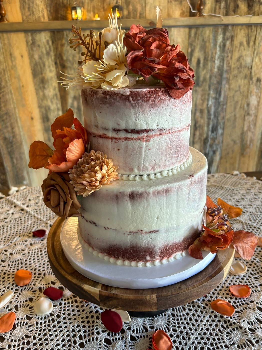 Semi-naked wedding cake with autumn flowers